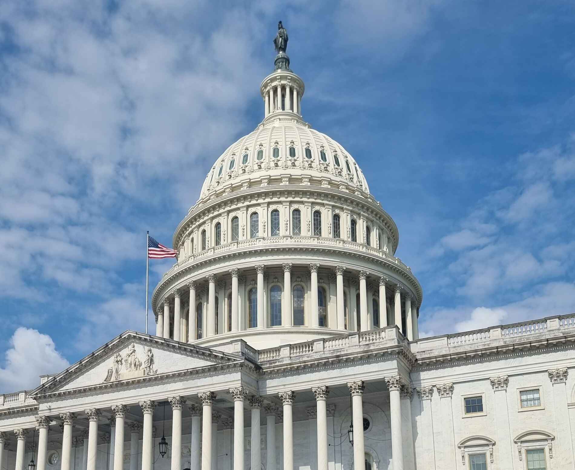 United States capitol building with cloudy sky