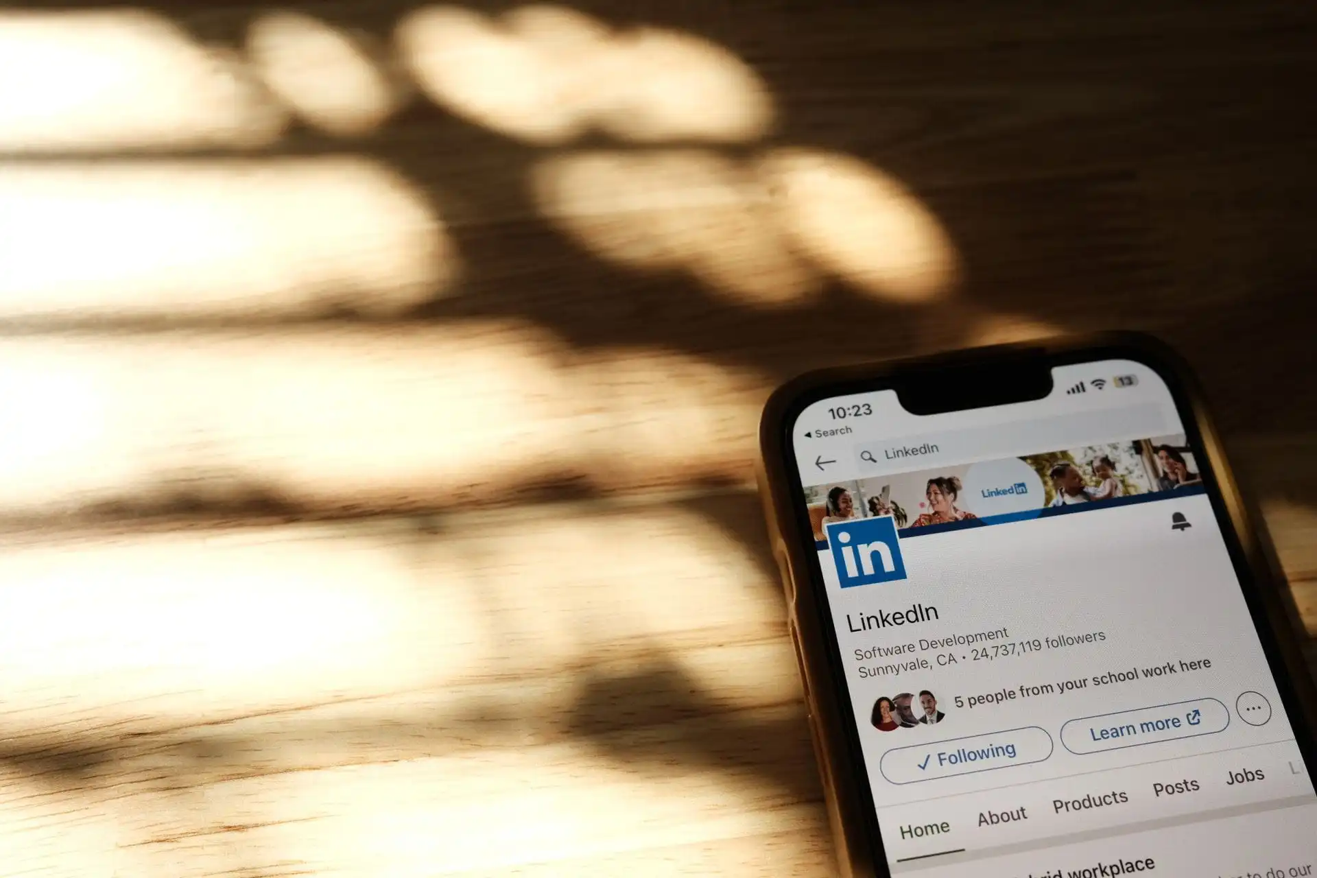 Close-up of a smartphone showing a LinkedIn profile page