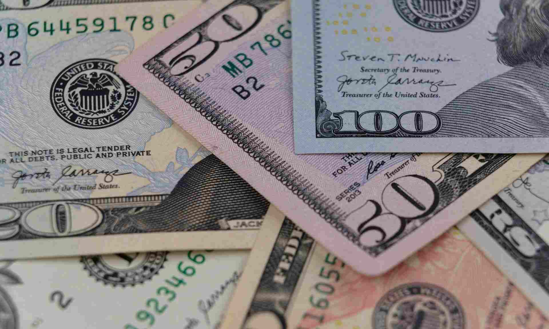 An assortment of U.S. dollar banknotes in multiple denominations