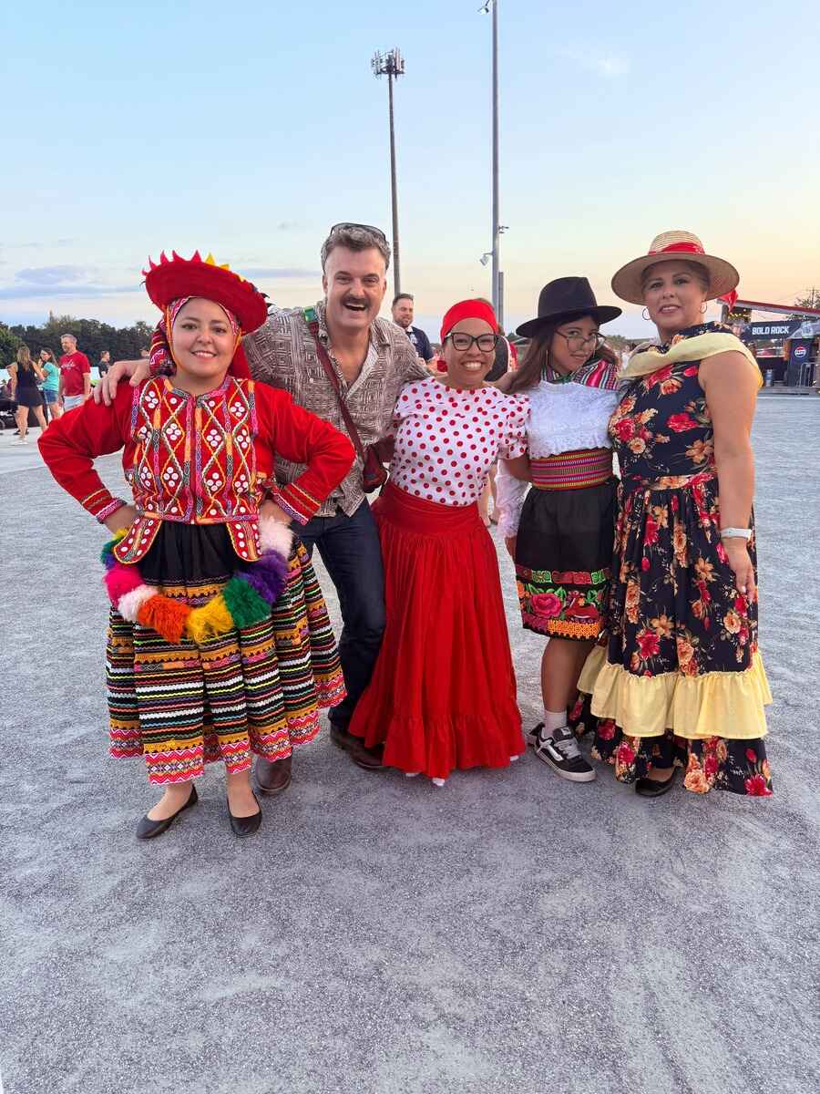 Ford Prior poses with group of dancers for hispanic heritage night